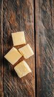Gourmet Cheese Cubes on Rustic Wooden Board photo