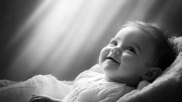 Smiling baby in white attire looks upwards with joy during a serene moment in soft light photo