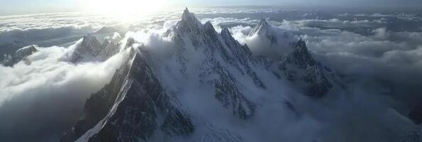Aerial view of mountain range in the clouds photo