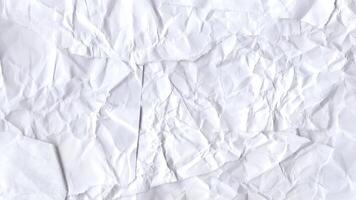 Crumpled white paper surface motion with soft shadows and folds video