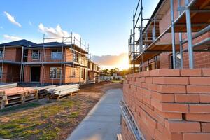A brick wall with scaffolding photo