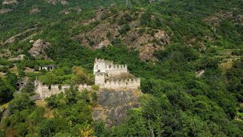 Aerial view with drone of the medieval castle of Cesnola located in Settimo Vittone Turin Italy video