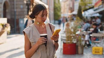 Tourist traveler woman girl using looking smartphone search a way on map in mobile navigator app video
