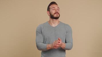 Young man showing thumbs up and nodding in approval, claps hands, successful nice work, good job video