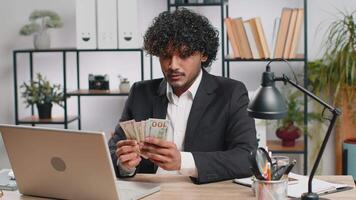 Rich businessman in suit working on laptop pc counting money cash, calculate earnings income profit video