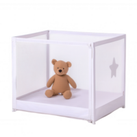 A soft teddy bear sits inside a white mesh playpen, creating a safe space for toddlers. Ideal for children's rooms and playful environments. png
