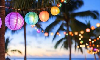Colorful paper lanterns hanging from palm trees at the beach photo