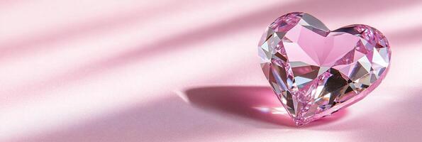 A pink diamond heart shaped object on a pink surface photo