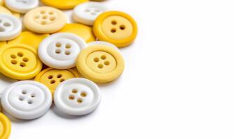 Yellow and white buttons on a white background photo