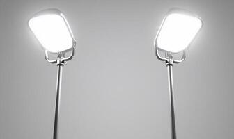 Two lamps on a gray background with one light on each side photo