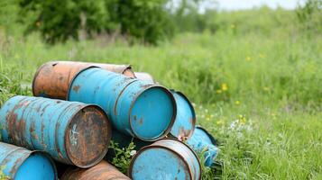 Old oil barrels in the field photo