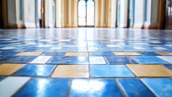 A close-up view of a patterned tile floor in a spacious hallway. photo