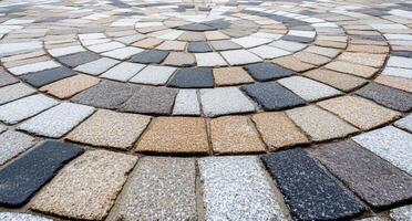 Circular pattern of interlocking stones in varying colors and textures. photo