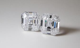 Two sparkling, cut crystal objects displayed on a neutral background. photo
