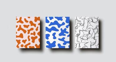 Three different colored paper bookmarks with a white background photo