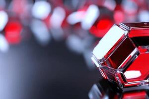 Close-up of red crystal-like objects on a reflective surface. photo