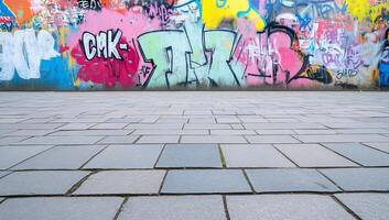 A skateboarder is riding a skateboard in front of a wall of graffiti photo