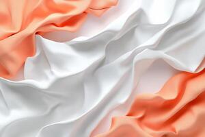 Soft, flowing fabric in orange and white hues, creating an elegant texture. photo