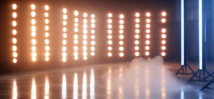 A scene featuring bright stage lights with smoke on a reflective floor. photo