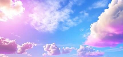 A serene sky with soft clouds and a gradient of pink and blue hues. photo