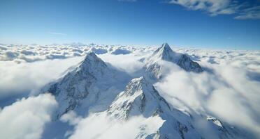 Majestic snow-capped mountains rising above a sea of clouds. photo