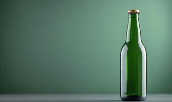 A green bottle of beer sitting on a table photo