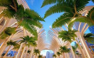 Giant ferns tower above a futuristic urban landscape under a bright blue sky photo