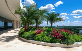 Rooftop garden adorned with lush greenery and vibrant flowers under a bright blue sky in a modern urban setting photo