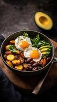 Delicious farm to table breakfast bowl featuring eggs, greens, and avocado served in rustic setting photo