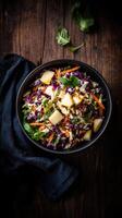 Farm to table fresh salad with vibrant vegetables and apples served in rustic wooden bowl photo