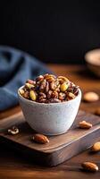 Delicious farm to table nut mix served in a rustic bowl on a wooden board in a cozy kitchen setting photo