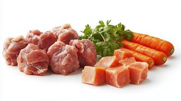 Fresh cuts of pork and chicken with carrots and cilantro on a white background photo