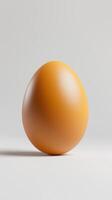 Single brown egg on a light background, perfectly smooth surface and natural color photo