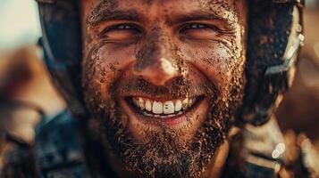 Smiling soldier with dirt-covered face showcasing joy and resilience in rugged environment photo