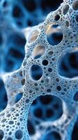 Close-up of intricate blue foam texture with bubbles and porous structure photo