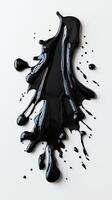 Abstract black paint splash on white background, dripping and spilling photo