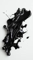 Abstract black paint splash on white background for artistic and design purposes photo