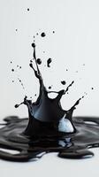 Black liquid splash creating dynamic shapes in a minimalistic artistic composition photo