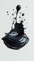Black paint splash over white background with textured swirl effects photo
