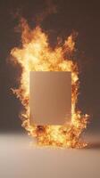 Flaming blank canvas surrounded by flames on a dark background photo