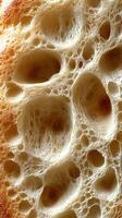 Close-up of air bubbles in freshly baked bread crust showing unique texture photo