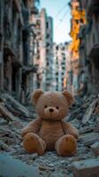 Abandoned teddy bear sitting on rubble in a devastated urban landscape photo
