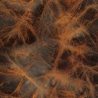 Close-up of textured brown leather background with intricate patterns and natural markings photo