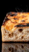 Close-up of crispy artisan bread with a glossy crust and visible air bubbles photo