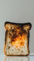 Burnt toast with golden center illuminated on a minimalist background photo