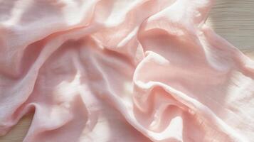Soft pink fabric with elegant folds in natural sunlight photo