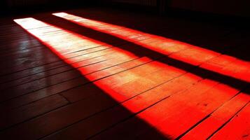 Warm sunlight casting long shadows on wooden floor in empty room photo