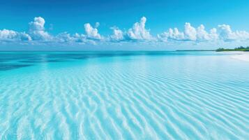 Tranquil turquoise ocean wave ripple surface under blue sky with cloud photo