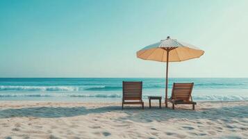 Serene beach with umbrella and chairs overlooking tranquil ocean waves photo