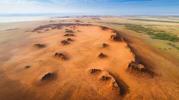 Aerial view of red sandstone formations in arid desert landscape photo